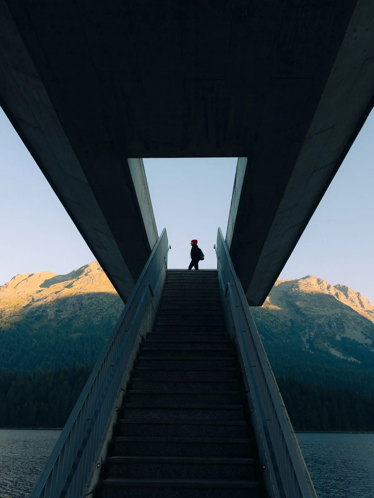A person on steps above Lake St.&nbsp;Moritz