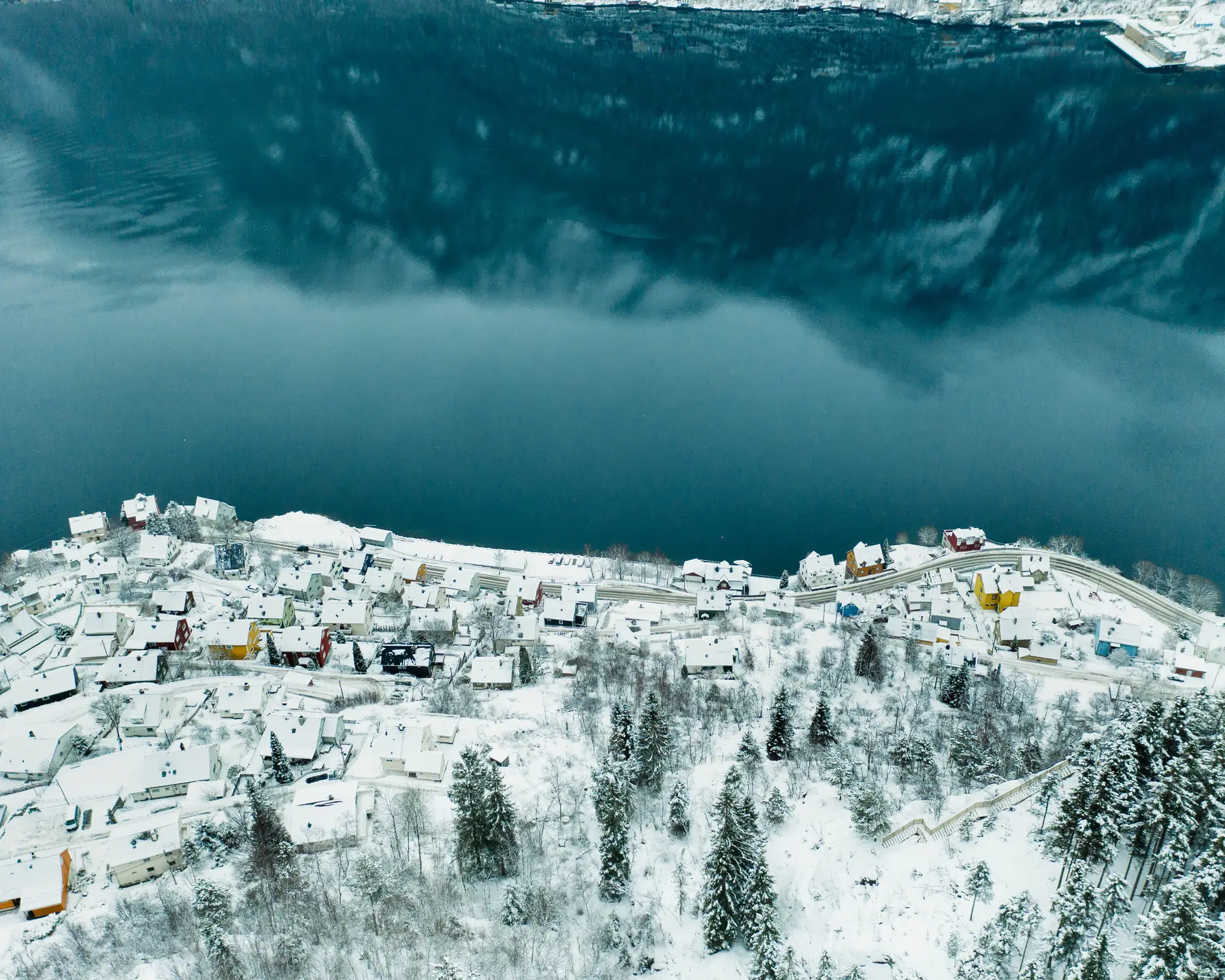 A winter aerial view of Odda beside the Hardangerfjord